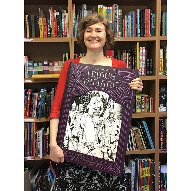 Woman holding large book